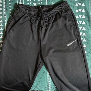Woman’s black Nike sweatpants size M